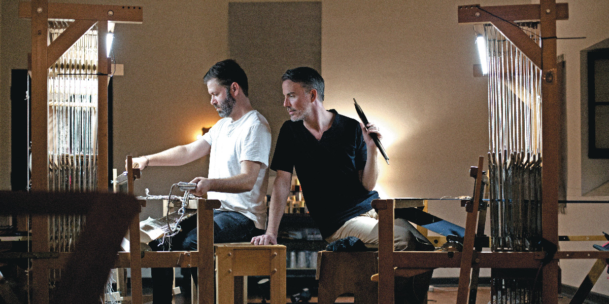 Sean and Andrew working the looms